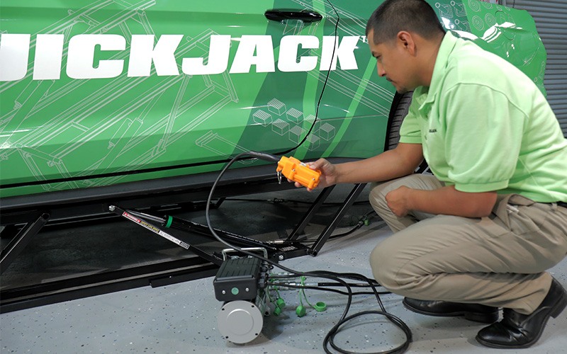 Push down button to lower QuickJack lift completely